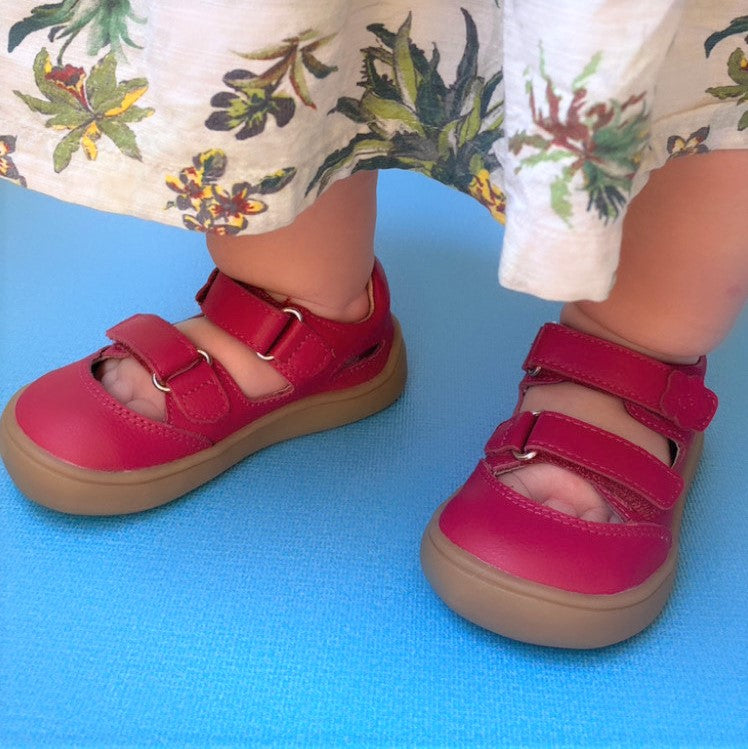 Stylish barefoot red leather sandals for small girls
