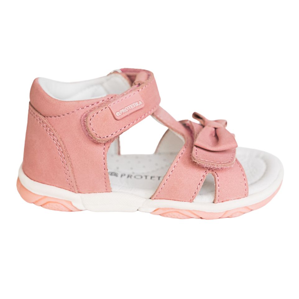 A pink toddler girl Protetika sandal with a hook-and-loop strap closure and a decorative bow detail in the front.