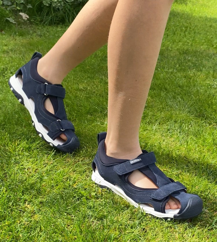Arch supporting orthotic suede leather sandals for older boys.