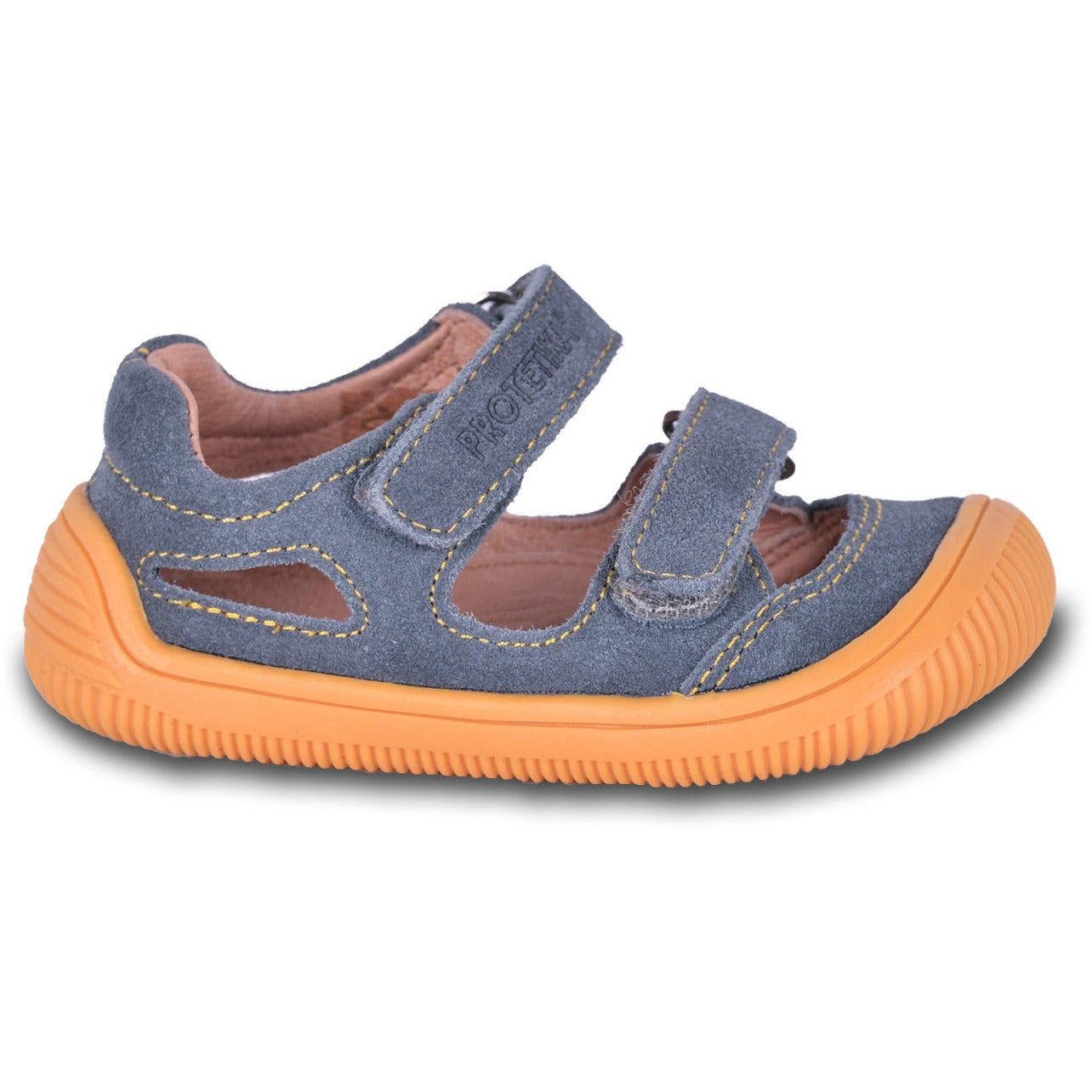 Toddler boy barefoot sneakers with a thin and flexible sole are a great option for an active first walker who spends time on natural surfaces, feeling the unevenness of the ground.