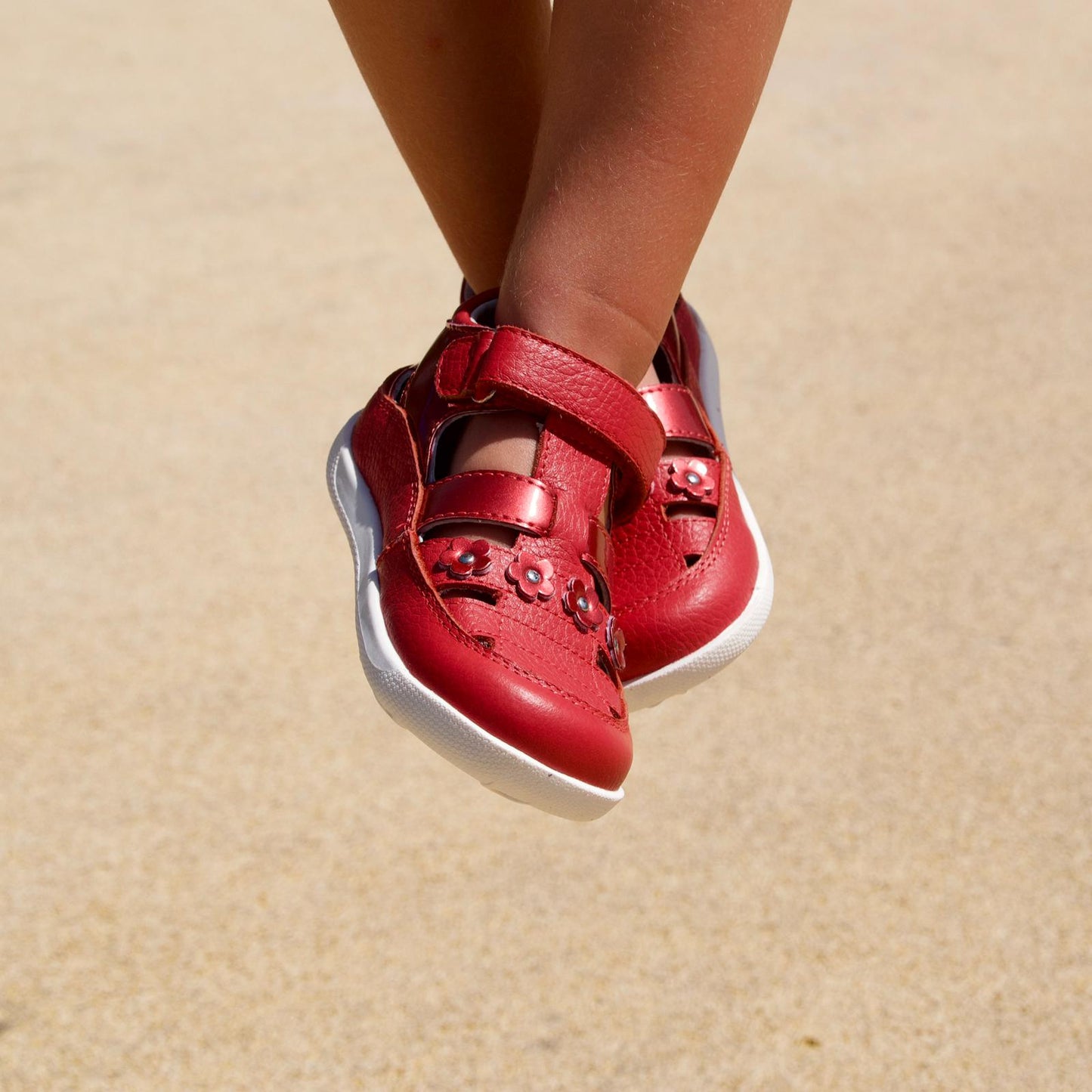 Stylish red sneakers for toddler girls match with every outfit.