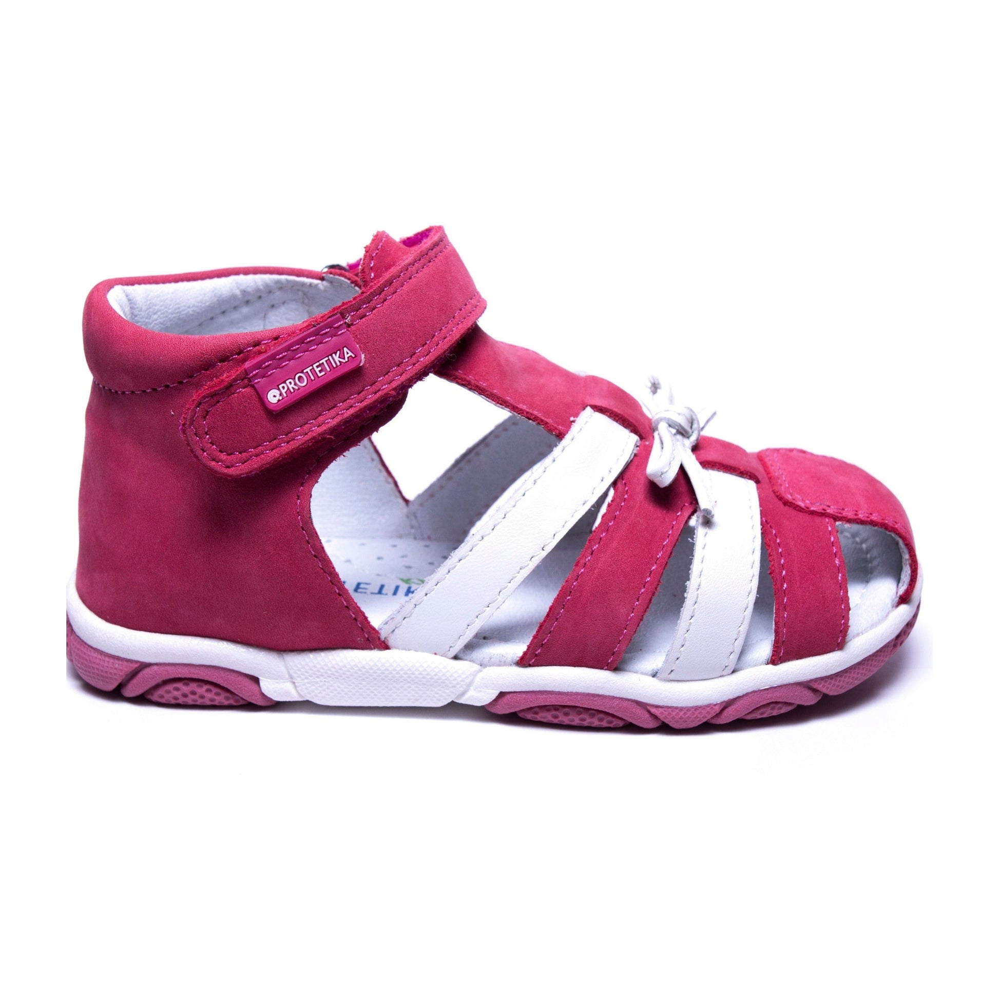 Toddler girls sandal with a mild arch support and a firm and solid heel counter to help keep the heel pointing straight. Suede leather on the upper.