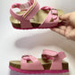 A presentation of pink orthotic sandals for older girls, from Protetika brand.